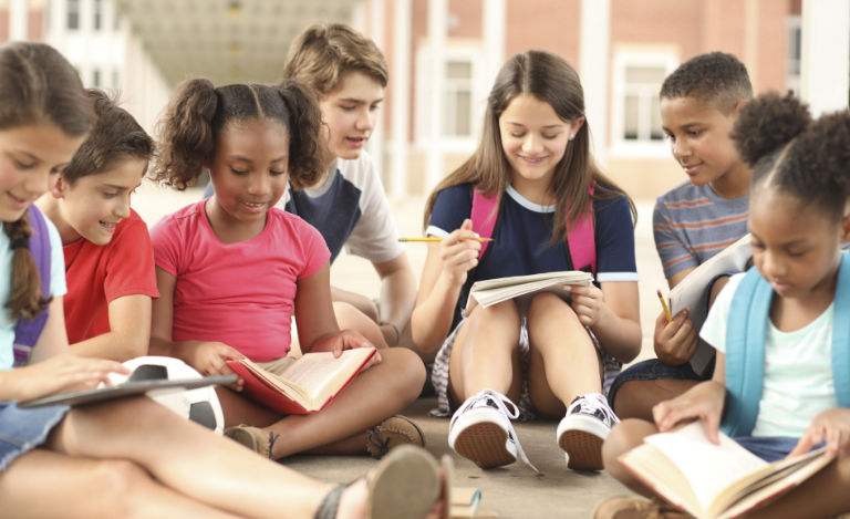 kids sitting together on the ground