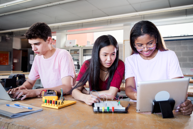 Students working together in a classroom.